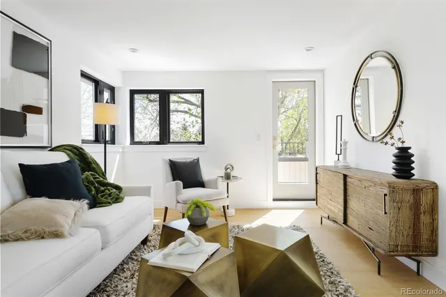 a view of a living room and a balcony