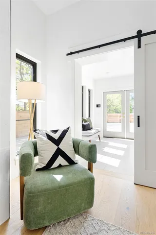 a living room with furniture or couch and a wooden floor