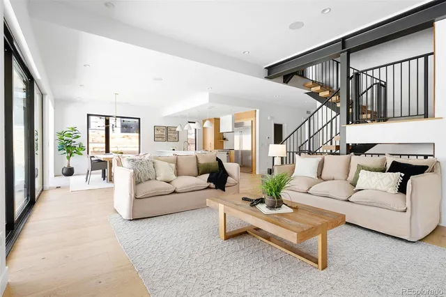 a spacious bedroom with a bed and a large window