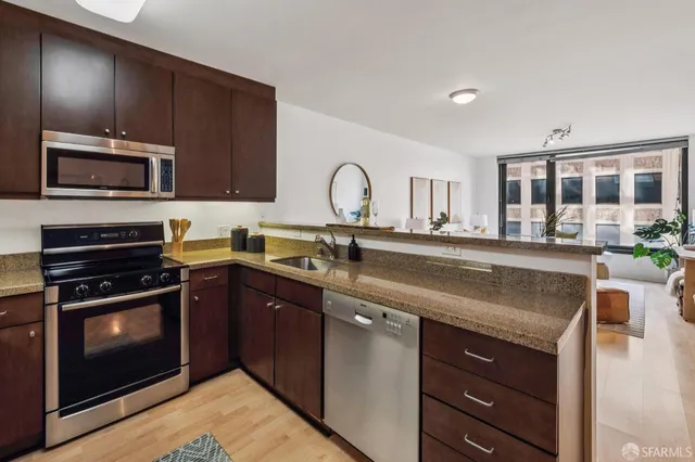 a kitchen with a stove and a microwave