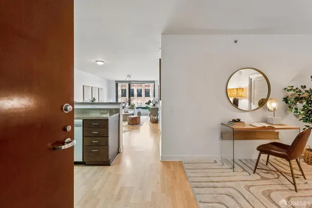 a view of a livingroom with furniture and a flat screen tv