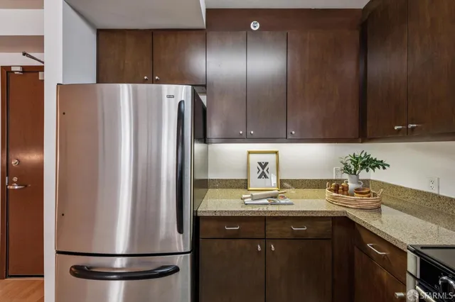 a bedroom with a bed and a chair