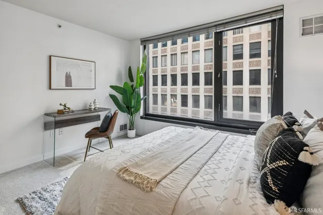 a bathroom with a double vanity sink toilet mirror and shower