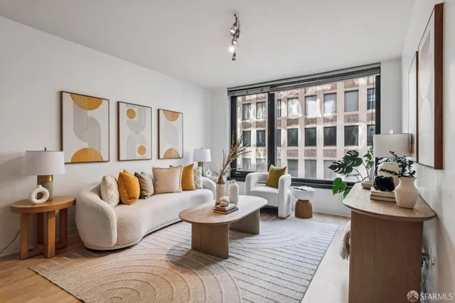 a living room with a couch and a lamp