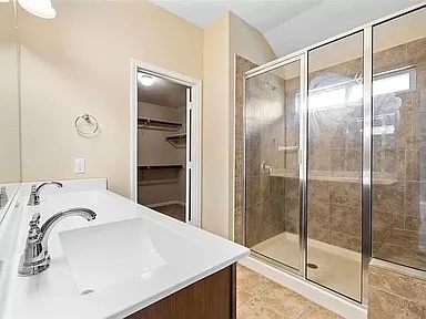 417 Tula Trail Leander, TX 78641 - Photo 16 of 24 a bathroom with a sink and a shower
