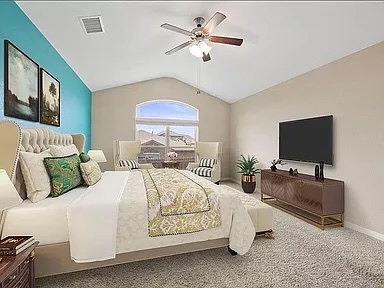 417 Tula Trail Leander, TX 78641 - Photo 8 of 24 a bedroom with bed tv and couch