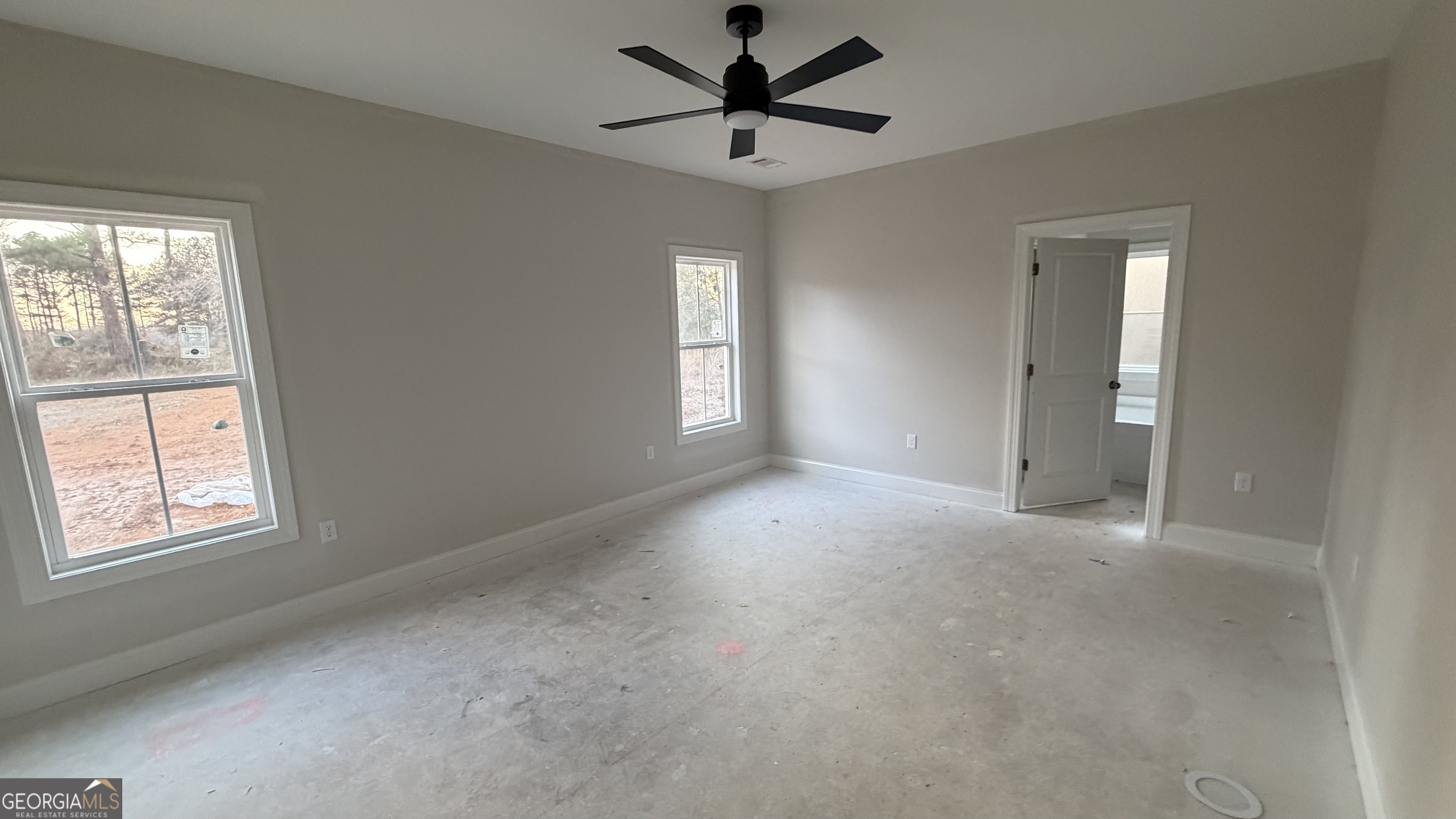 905 Sweet Magnolia Lane Dublin, GA 31021 - Photo 37 of 53 a view of a livingroom with a window and a ceiling fan