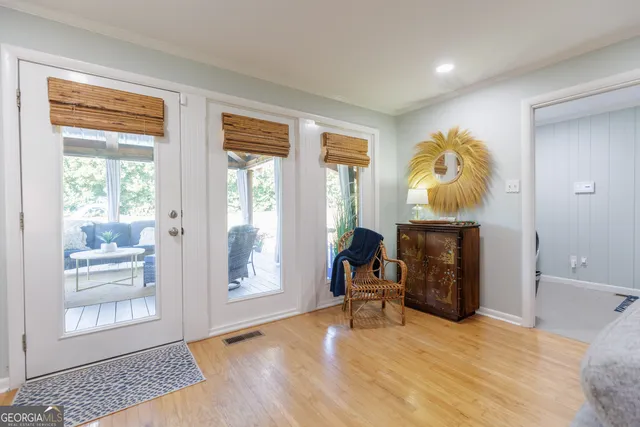 a view of a livingroom with a fireplace and workspace