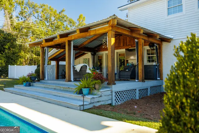 a view of a chairs and table in a patio