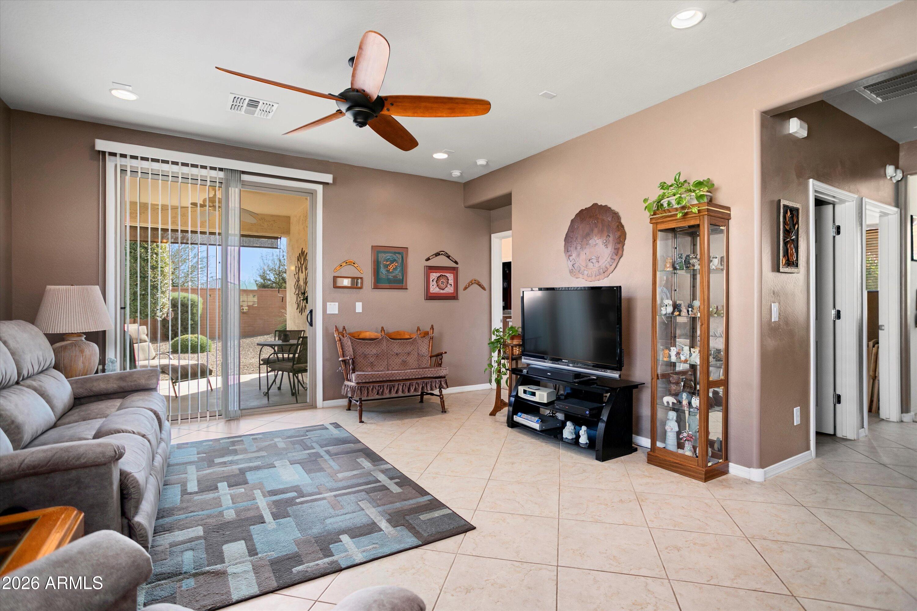 21613 North 261st Avenue Buckeye, AZ 85396 - Photo 13 of 52 a living room with furniture and wooden floor