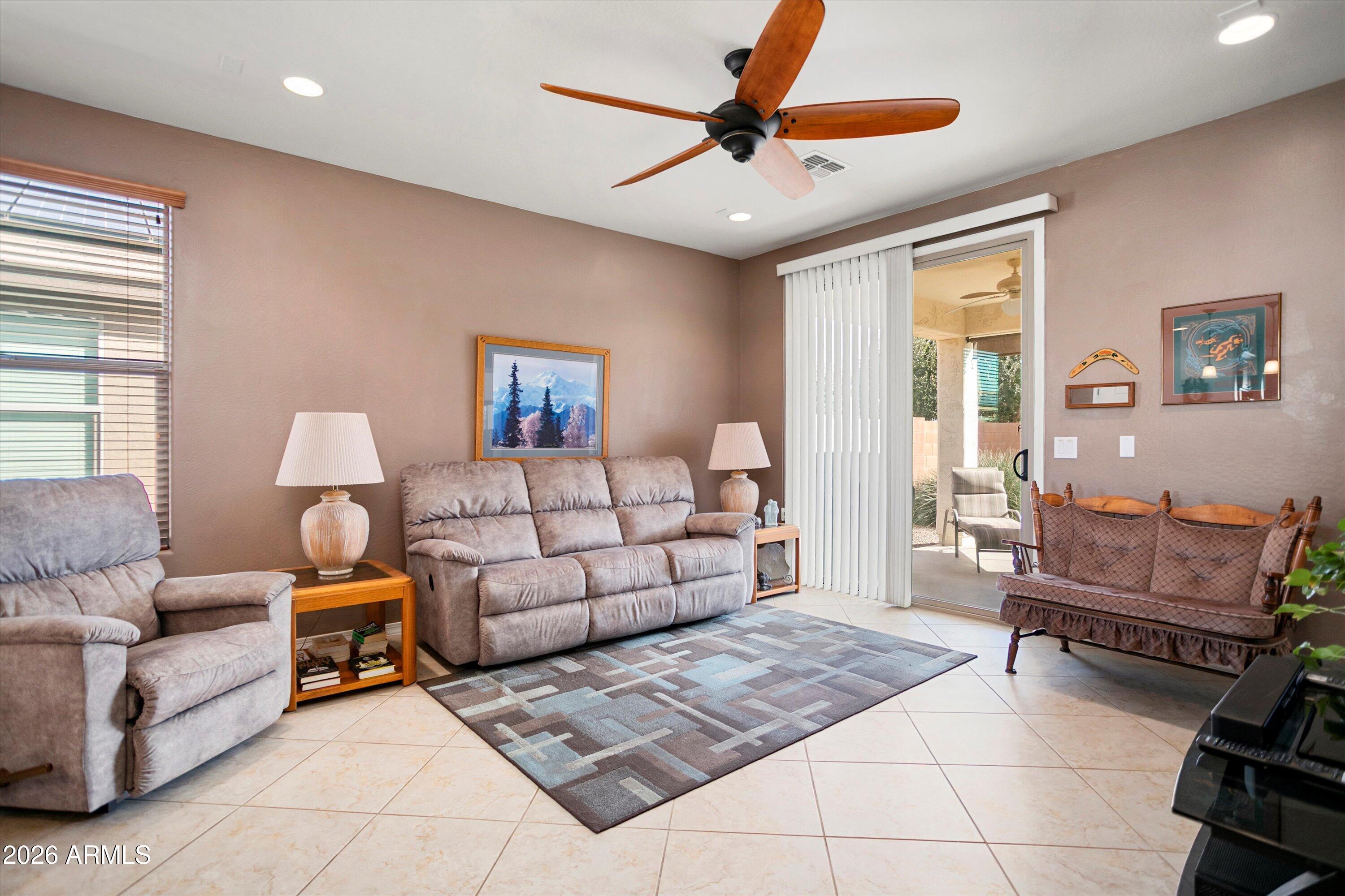 21613 North 261st Avenue Buckeye, AZ 85396 - Photo 15 of 52 a bedroom with furniture and a large window
