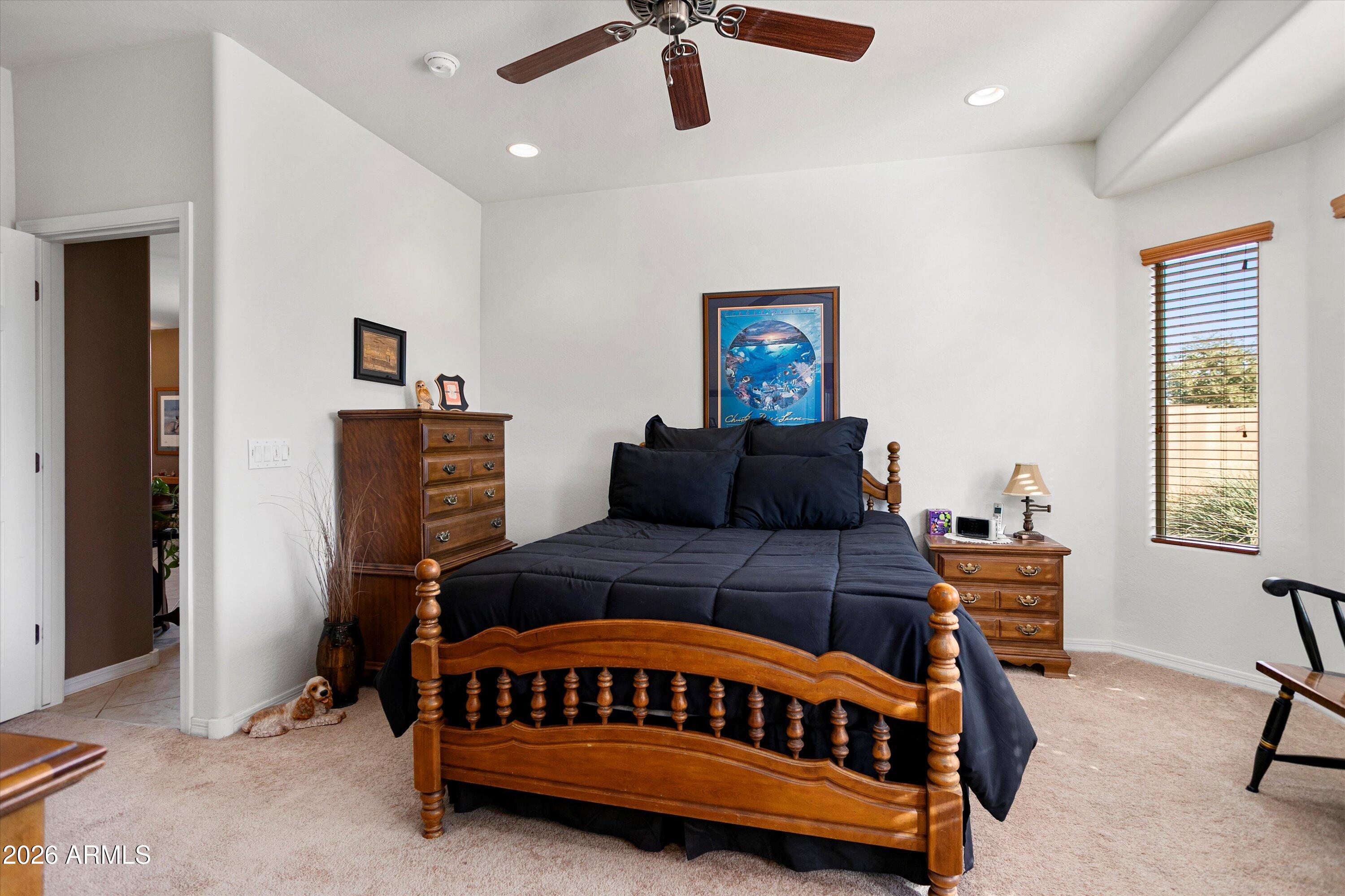 21613 North 261st Avenue Buckeye, AZ 85396 - Photo 18 of 52 a bedroom with furniture and a window