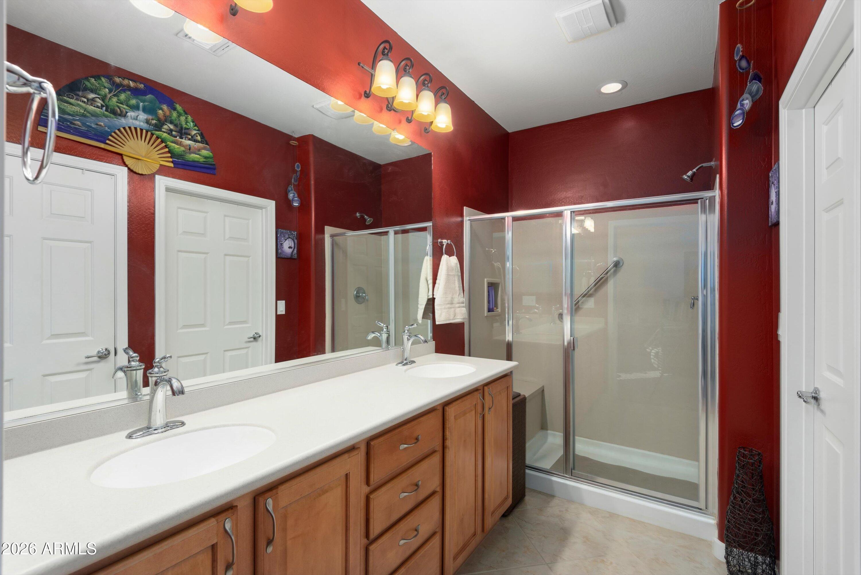 21613 North 261st Avenue Buckeye, AZ 85396 - Photo 19 of 52 a bathroom with a sink double vanity and a mirror