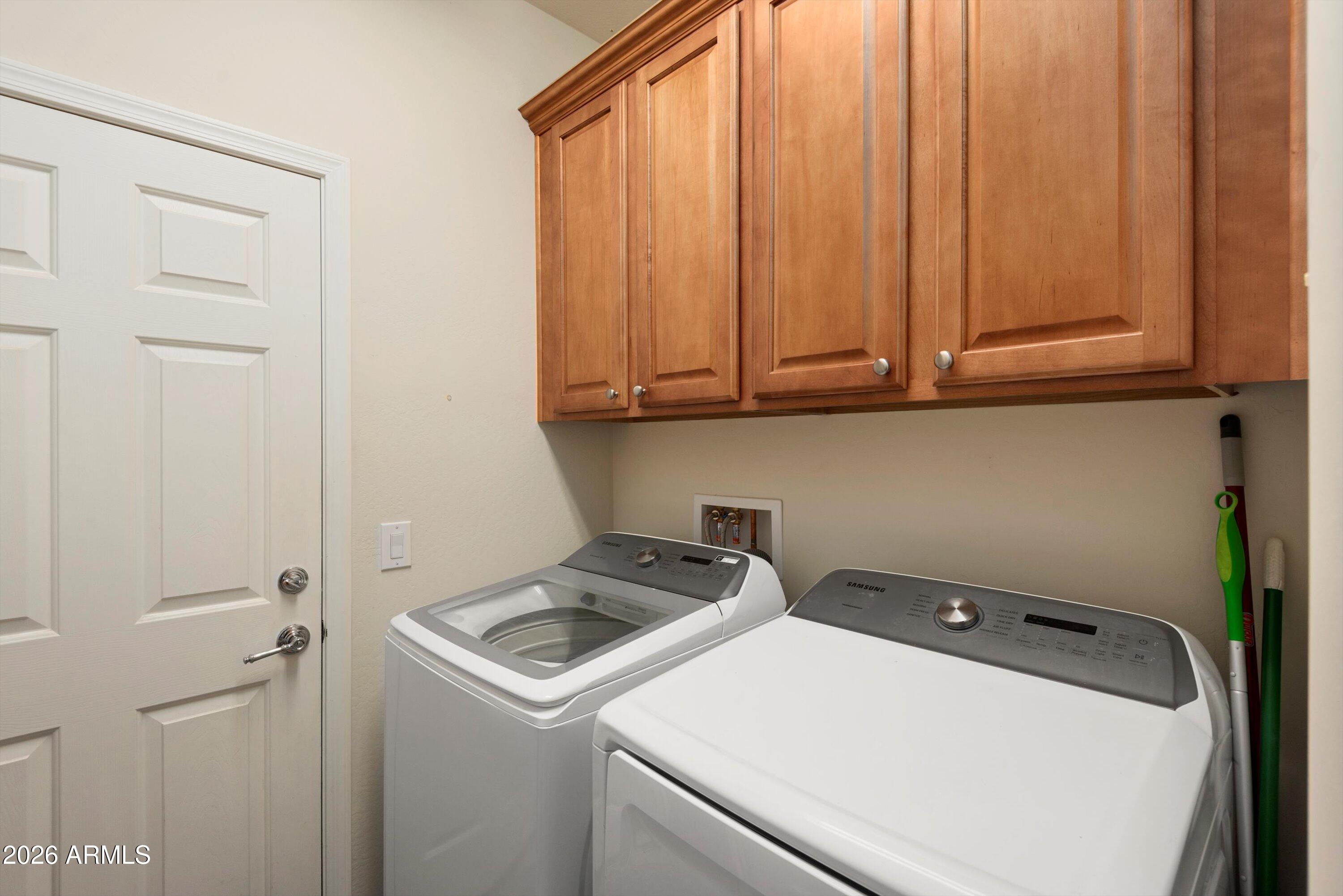 21613 North 261st Avenue Buckeye, AZ 85396 - Photo 23 of 52 a view of storage and utility room with washer and dryer