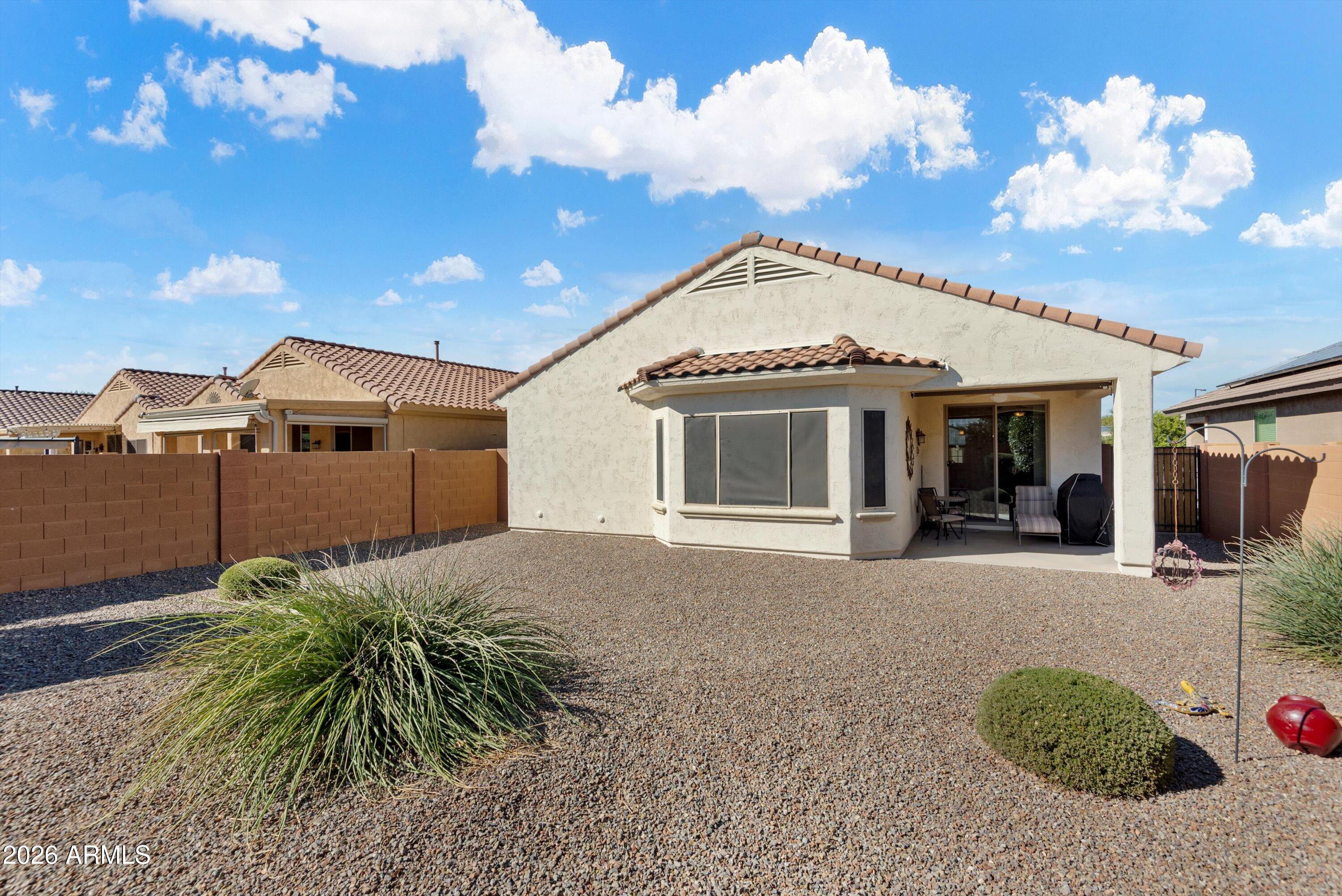 21613 North 261st Avenue Buckeye, AZ 85396 - Photo 29 of 52 a view of a house with a backyard