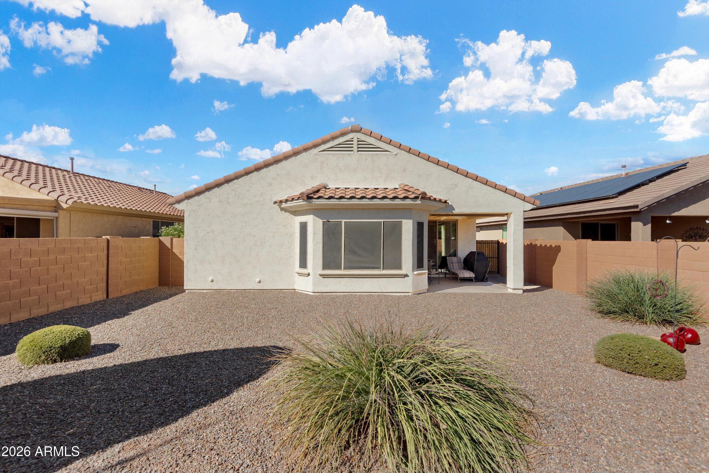 21613 North 261st Avenue Buckeye, AZ 85396 - Photo 30 of 52 a front view of a house with garden