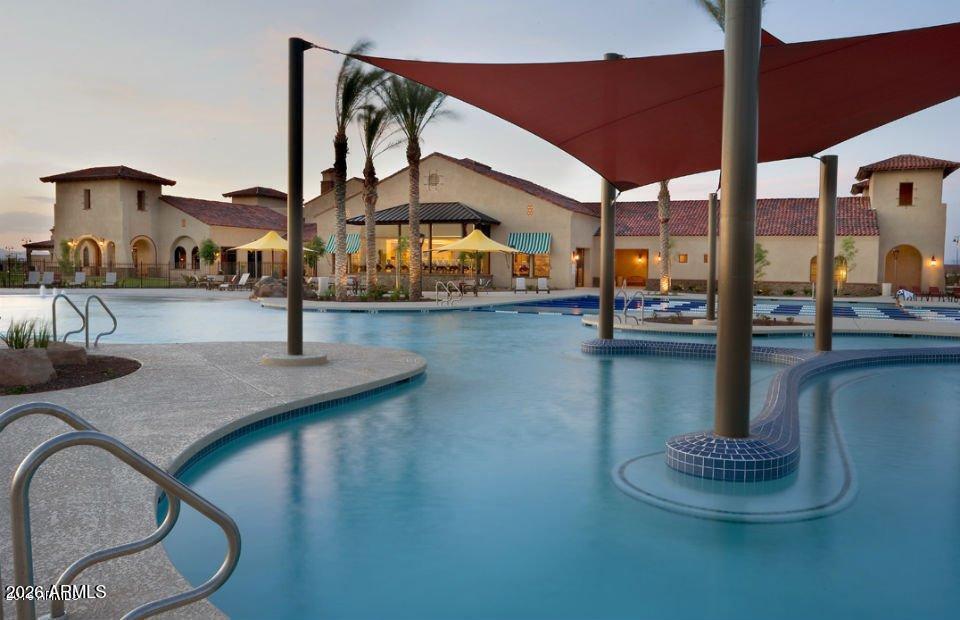 21613 North 261st Avenue Buckeye, AZ 85396 - Photo 33 of 52 a view of a swimming pool with outdoor seating