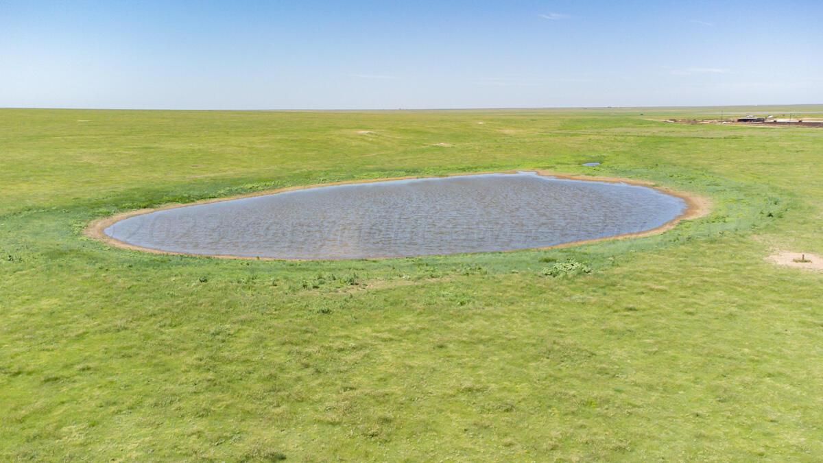 Walcott Ranch Hereford, TX 79045 - Photo 5 of 53 a view of a lake with a beach