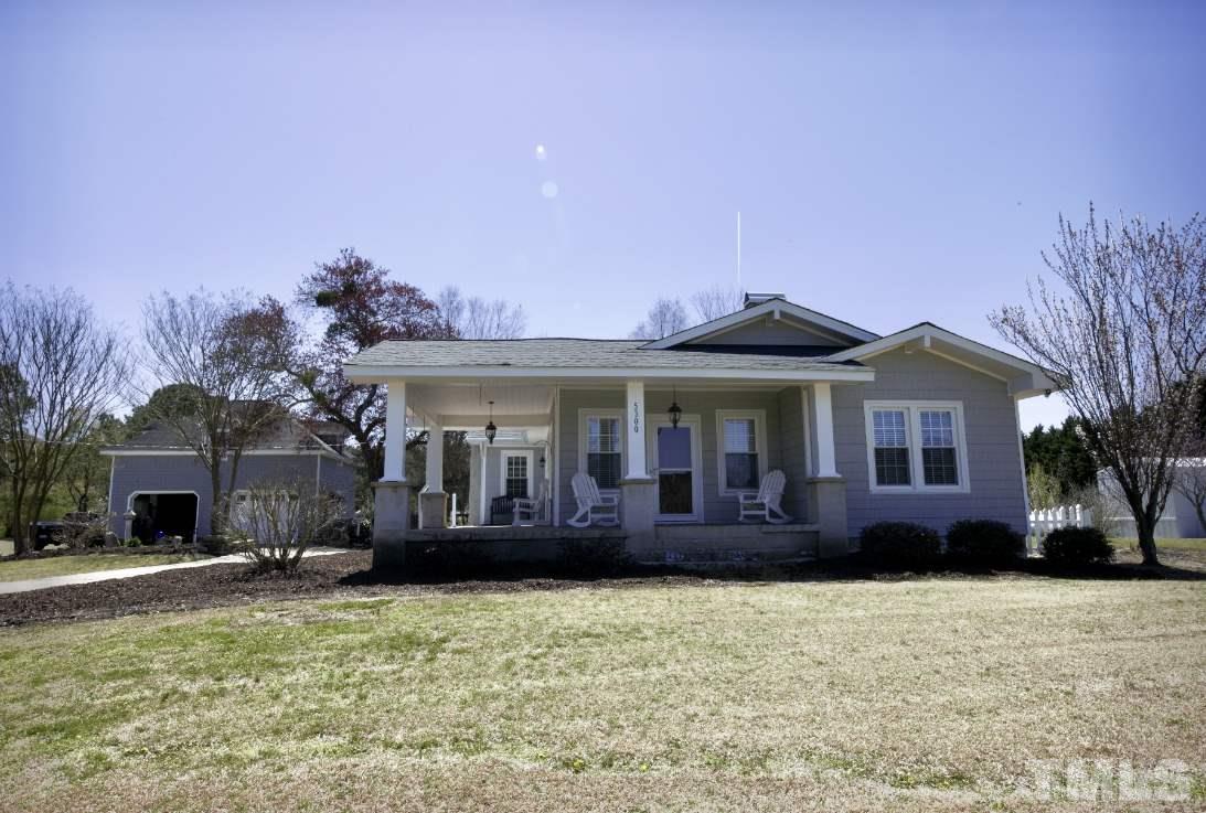 5300 Mitchell Mill Road Wake Forest, NC 27587 - Photo 1 of 27 a front view of a house with a yard