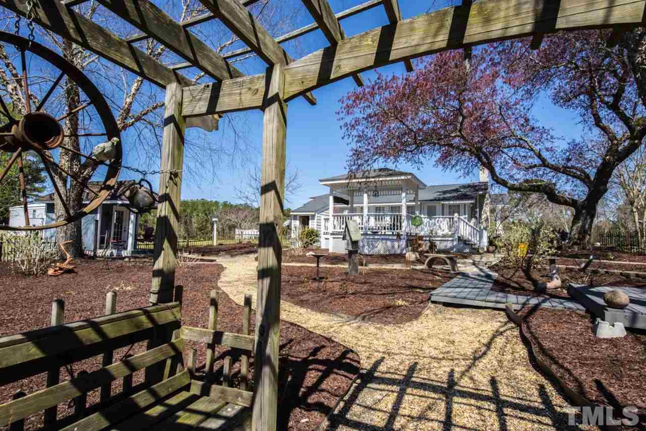 5300 Mitchell Mill Road Wake Forest, NC 27587 - Photo 2 of 27 a view of a backyard with sitting area