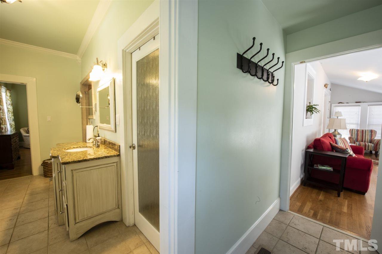 5300 Mitchell Mill Road Wake Forest, NC 27587 - Photo 13 of 27 a en suite bathroom with a sink and mirror