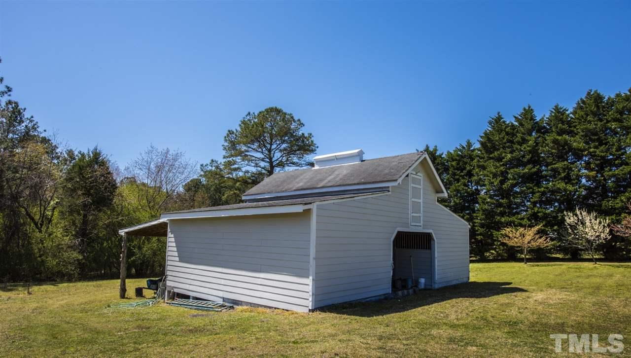5300 Mitchell Mill Road Wake Forest, NC 27587 - Photo 16 of 27 a backyard of a house with lots of green space