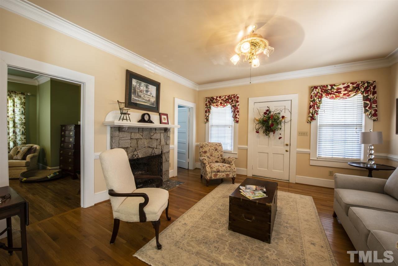 5300 Mitchell Mill Road Wake Forest, NC 27587 - Photo 3 of 27 a living room with furniture and a fireplace