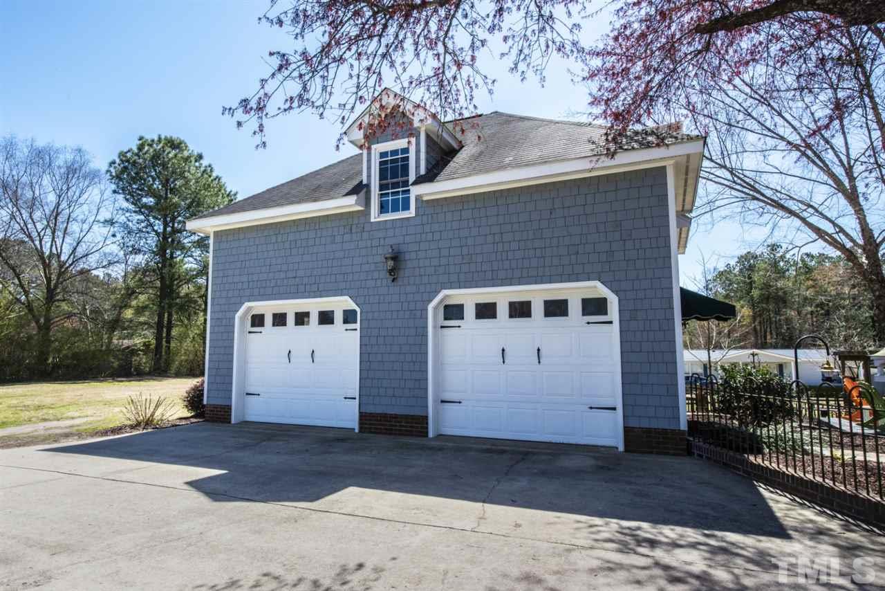 5300 Mitchell Mill Road Wake Forest, NC 27587 - Photo 21 of 27 a front view of a house with a garage