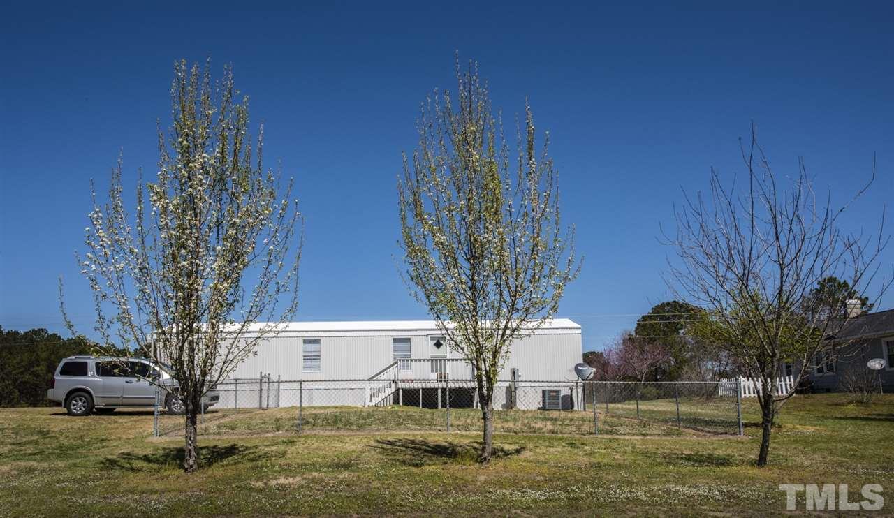 5300 Mitchell Mill Road Wake Forest, NC 27587 - Photo 26 of 27 a front view of a house with garden