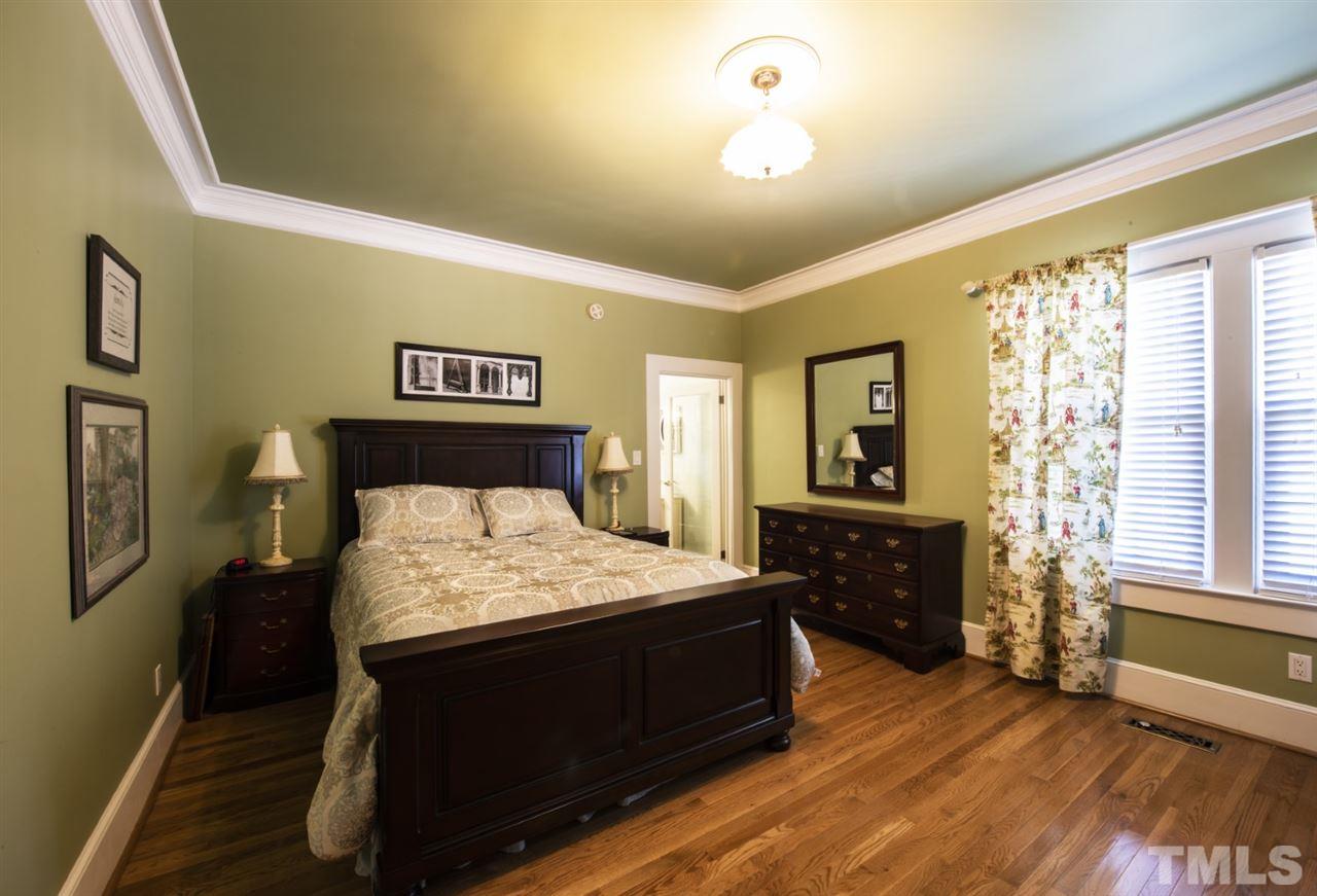 5300 Mitchell Mill Road Wake Forest, NC 27587 - Photo 9 of 27 a bedroom with a bed and wooden floor