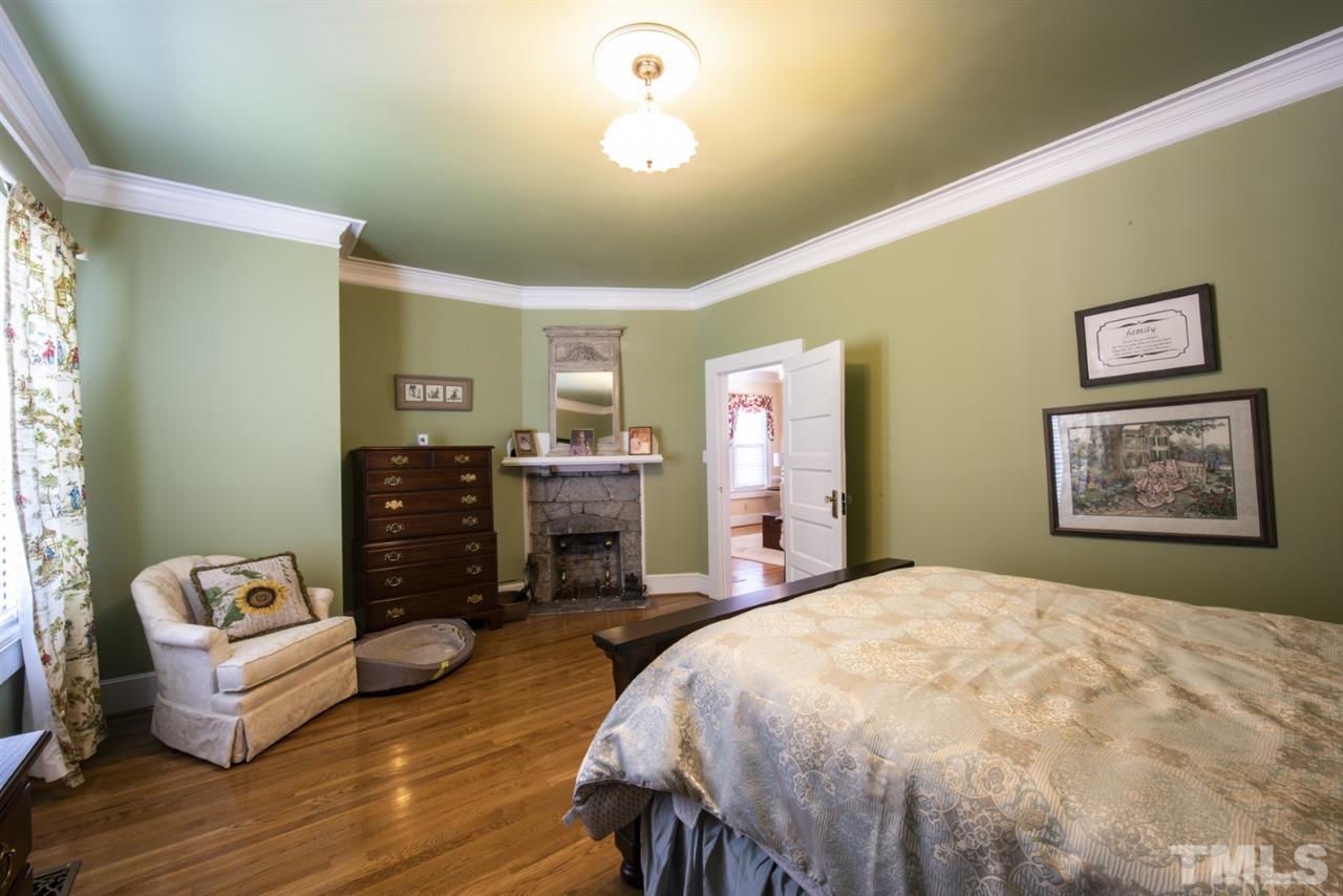 5300 Mitchell Mill Road Wake Forest, NC 27587 - Photo 10 of 27 a spacious bedroom with a bed and a couch