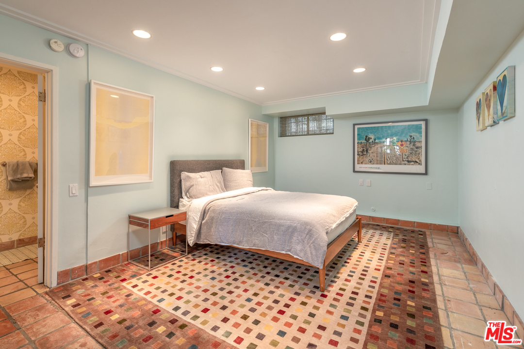 548 Dryad Road Santa Monica, CA 90402 - Photo 14 of 34 a bedroom with a large bed and a window