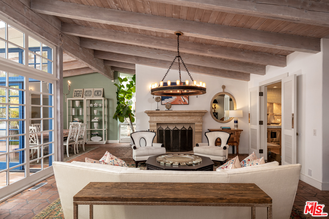 548 Dryad Road Santa Monica, CA 90402 - Photo 2 of 34 a view of a livingroom with furniture wooden floor a fireplace and windows