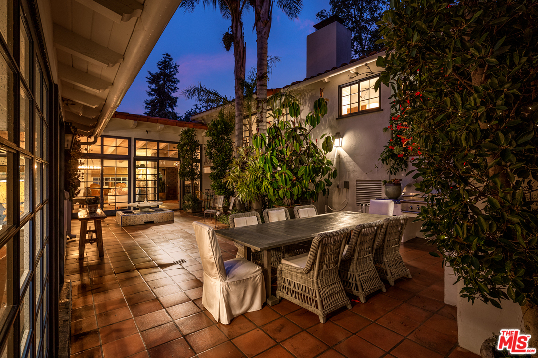 548 Dryad Road Santa Monica, CA 90402 - Photo 29 of 34 a view of a patio with a table and chairs and potted plants