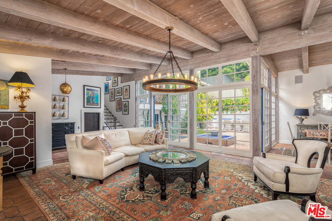 548 Dryad Road Santa Monica, CA 90402 - Photo 3 of 34 a living room with furniture a table and a chandelier