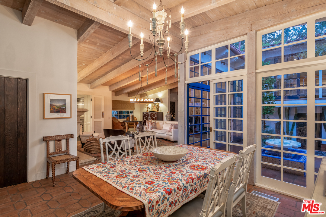 548 Dryad Road Santa Monica, CA 90402 - Photo 32 of 34 a bed room with furniture and a chandelier