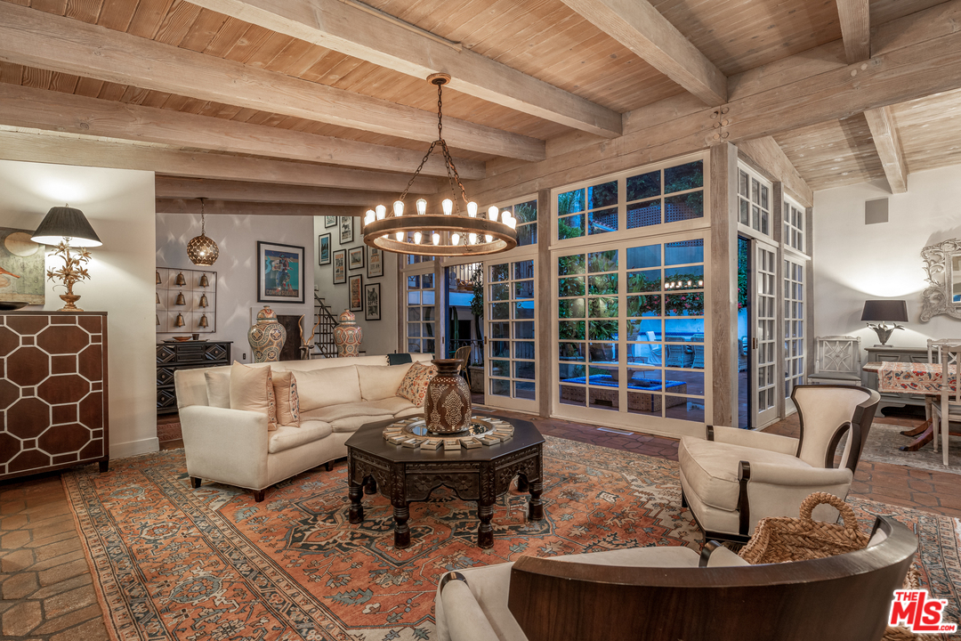 548 Dryad Road Santa Monica, CA 90402 - Photo 33 of 34 a living room with furniture and a chandelier