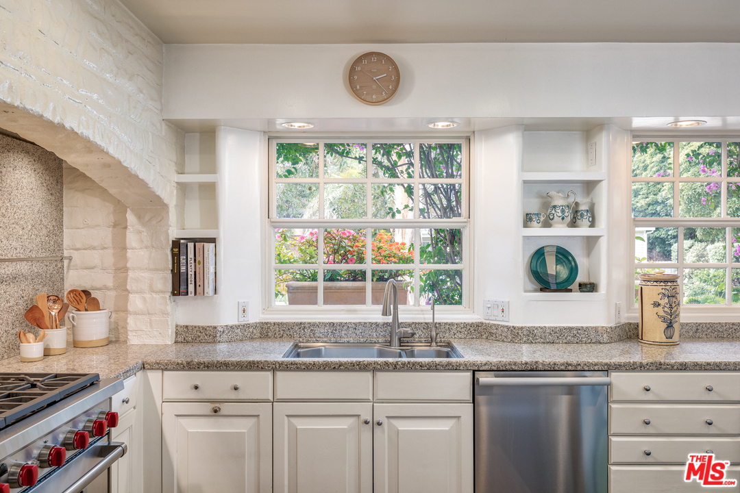 548 Dryad Road Santa Monica, CA 90402 - Photo 8 of 34 a kitchen with granite countertop a sink and a window
