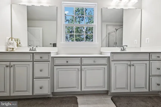 a bedroom with a bed a table and a flat screen tv