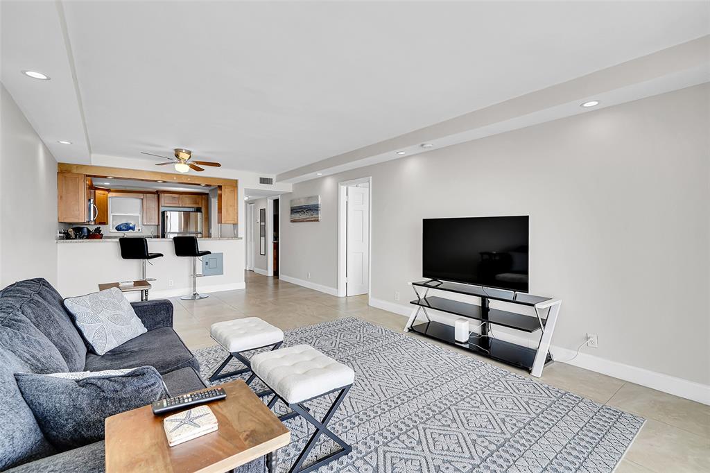 400 North Surf Road, Unit 703 Hollywood, FL 33019 - Photo 26 of 50 a living room with furniture and a flat screen tv