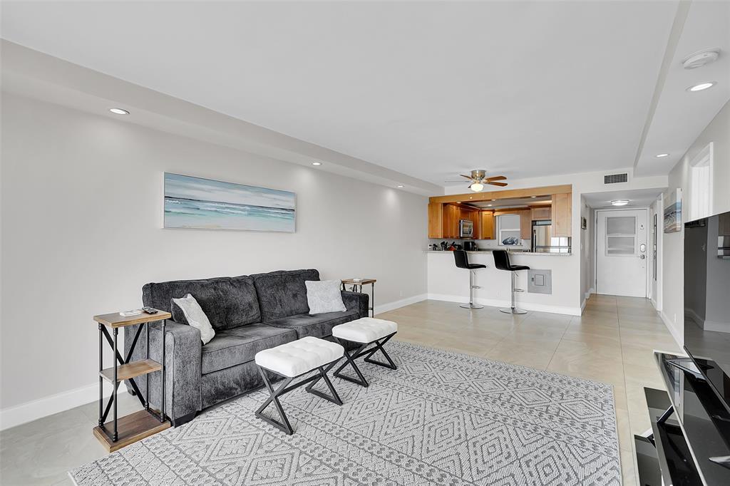 400 North Surf Road, Unit 703 Hollywood, FL 33019 - Photo 28 of 50 a living room with furniture and a flat screen tv