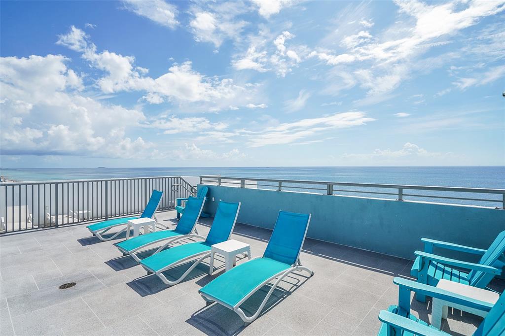 400 North Surf Road, Unit 703 Hollywood, FL 33019 - Photo 44 of 50 a roof deck with table and chairs