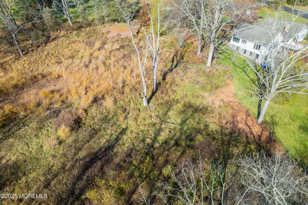 a backyard of a house with large trees