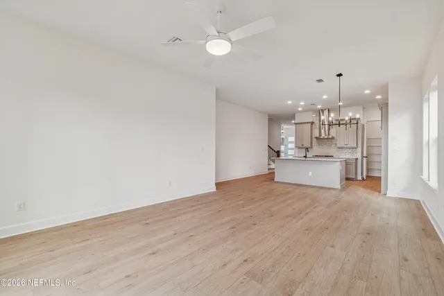 a view of a kitchen with microwave and cabinets