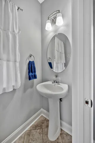 a bathroom with a sink a mirror and vanity