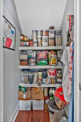 a room with lots of books and a book shelf