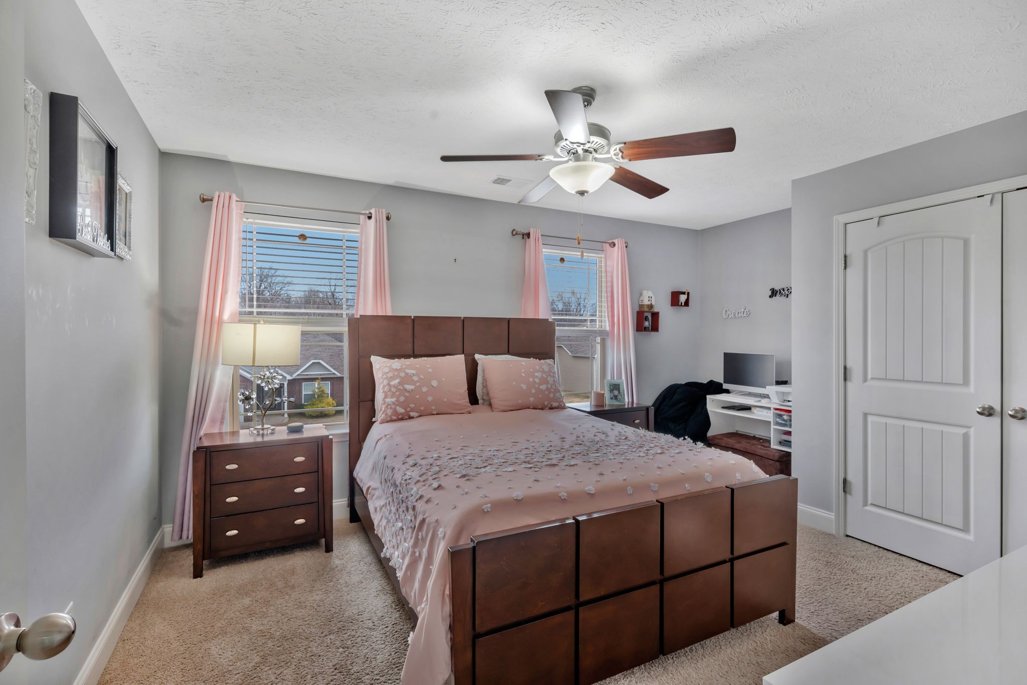 1043 Berra Drive Springfield, TN 37172 - Photo 15 of 33 a bedroom with a bed and a chandelier