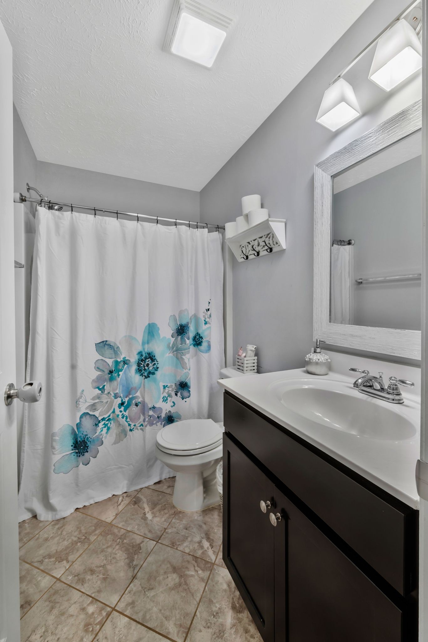 1043 Berra Drive Springfield, TN 37172 - Photo 19 of 33 a bathroom with a granite countertop sink and a mirror