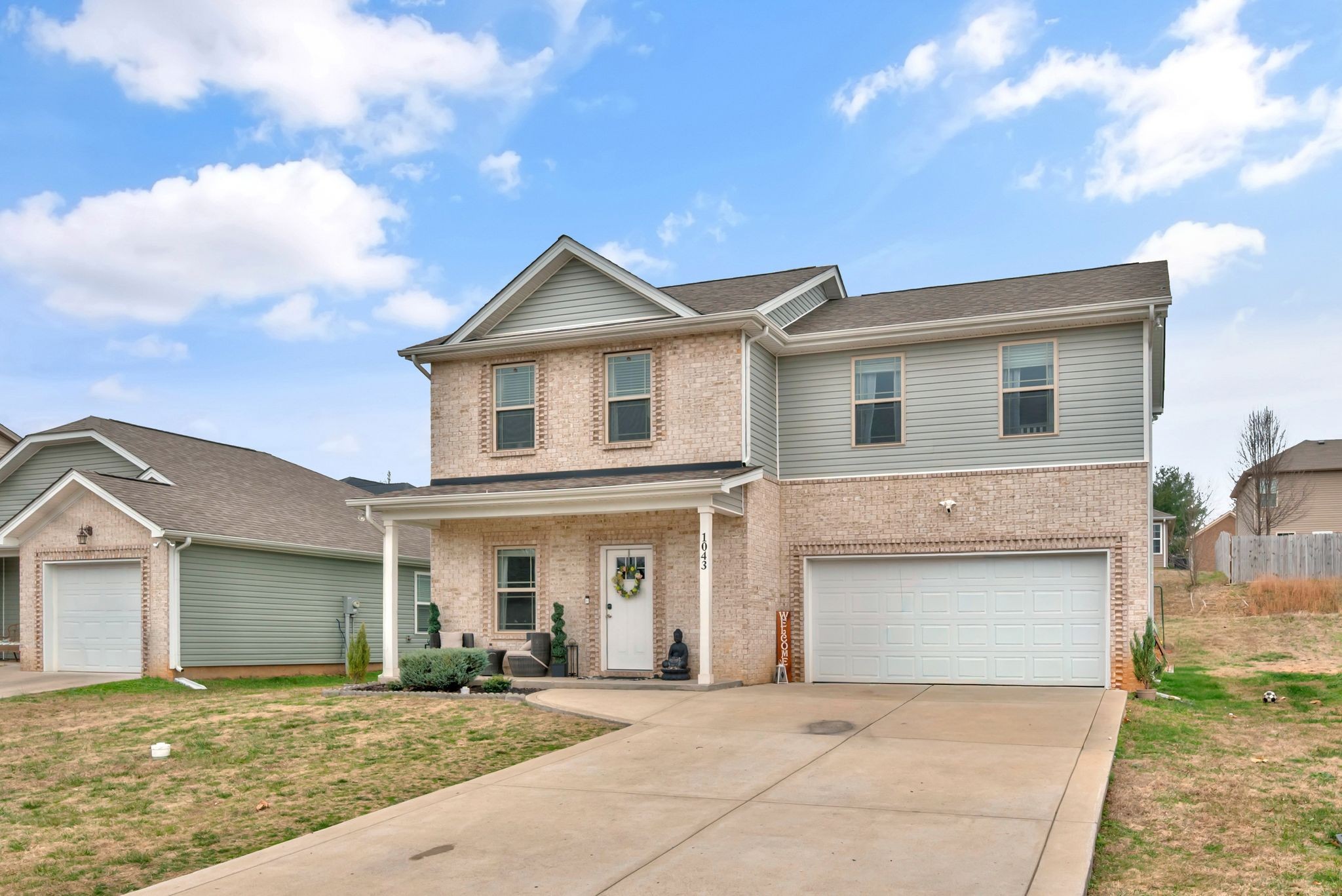 1043 Berra Drive Springfield, TN 37172 - Photo 2 of 33 a front view of a house with a yard and garage