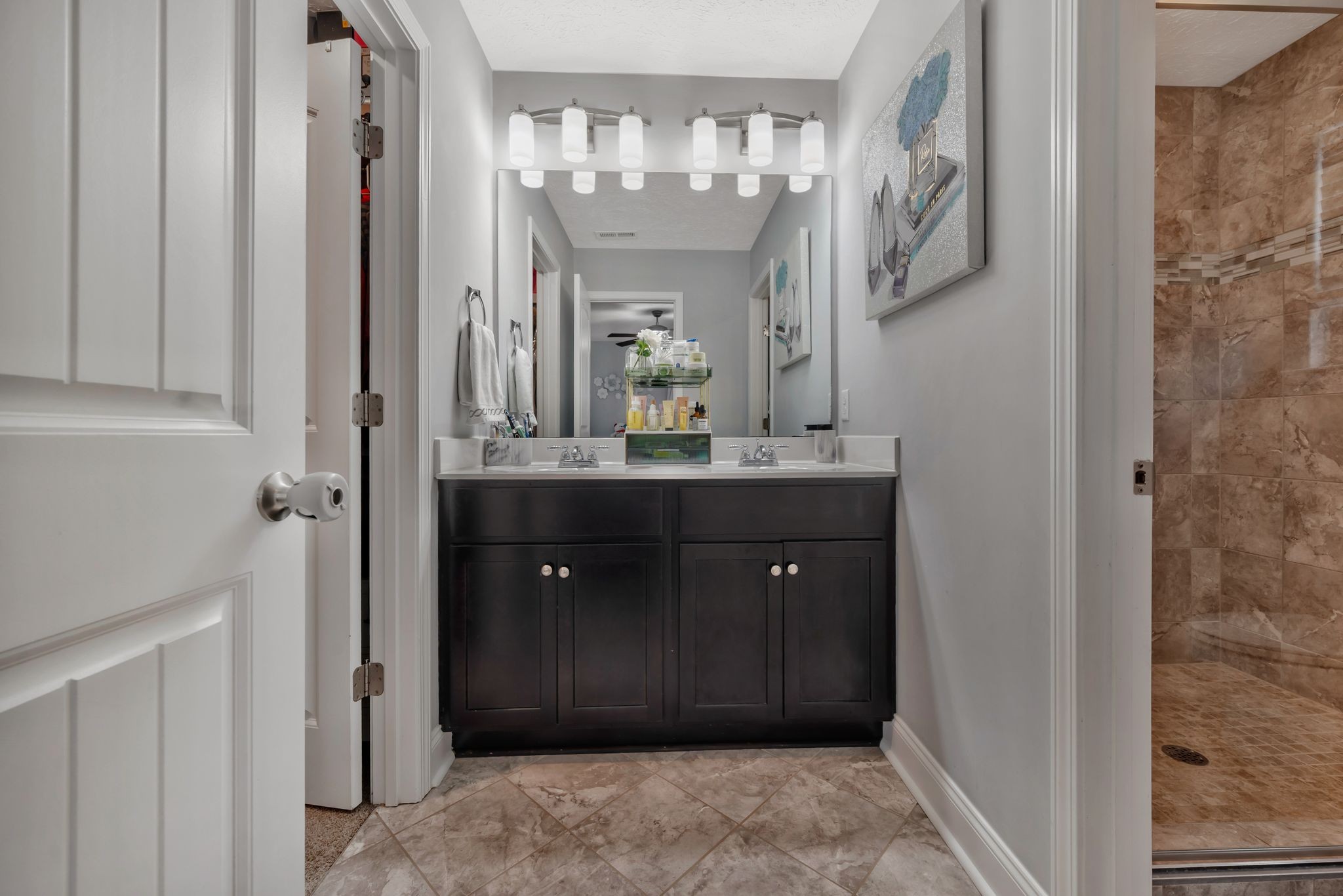 1043 Berra Drive Springfield, TN 37172 - Photo 24 of 33 a bathroom with a granite countertop sink a mirror and a shower